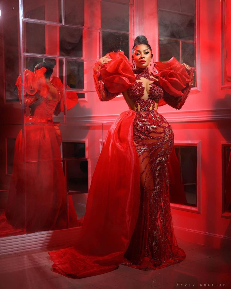  Toke Makinwa in a see through red lace dress