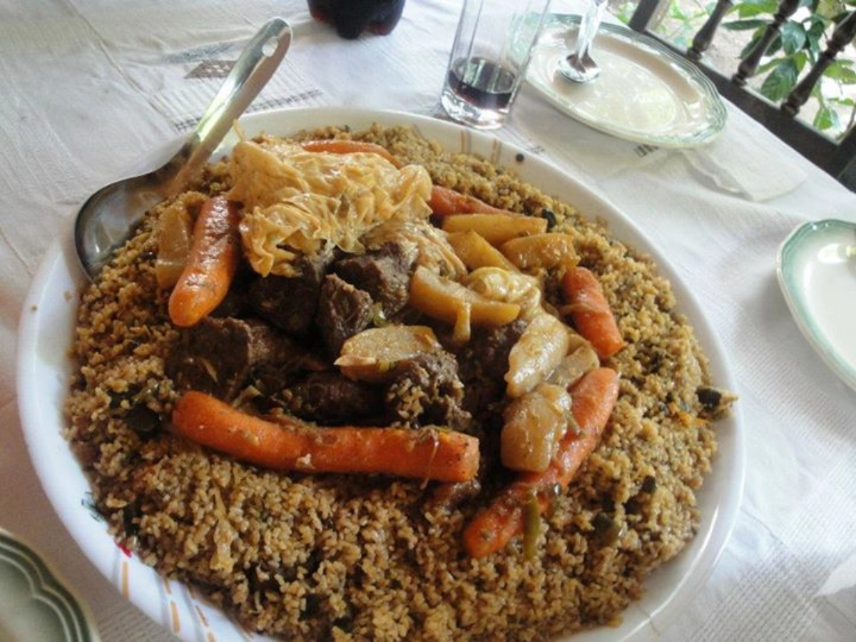 Indulge in the savory delight of Riz Gras, a flavorful dish from Burkina Faso! 🍛 Experience the rich blend of spices and tender meat in this West African culinary masterpiece. #RizGras #BurkinaFaso Photo Credit: Wikipedia