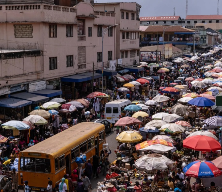 Where commerce dances to the rhythm of culture: Ghana’s vibrant markets, a symphony of colors, sounds, and entrepreneurial spirit.” 🌍🛍️✨. Photo Credit: New York Times