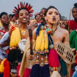 The Umhlanga Reed Dance in Eswatini is a vibrant annual cultural celebration that showcases the nation’s unity and pride. Thousands of unmarried and childless Swazi girls and women gather to cut reeds, present them to the Queen Mother, and dance in a grand procession. Photo Credit: Kim Paffen Photography/ourplanetinmylens.com