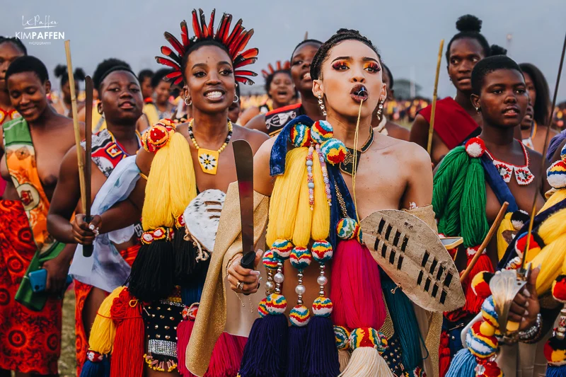 The Umhlanga Reed Dance in Eswatini is a vibrant annual cultural celebration that showcases the nation’s unity and pride. Thousands of unmarried and childless Swazi girls and women gather to cut reeds, present them to the Queen Mother, and dance in a grand procession. Photo Credit: Kim Paffen Photography/ourplanetinmylens.com