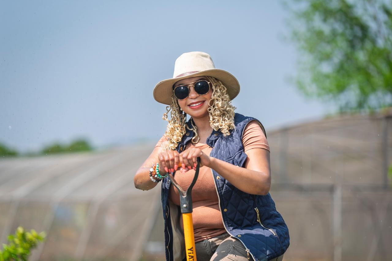 Tumi Moalusi stands tall with a fork spade in hand — a symbol of purpose, strength, and the new face of African agripreneurship. Photo Credit: Nala-Temo