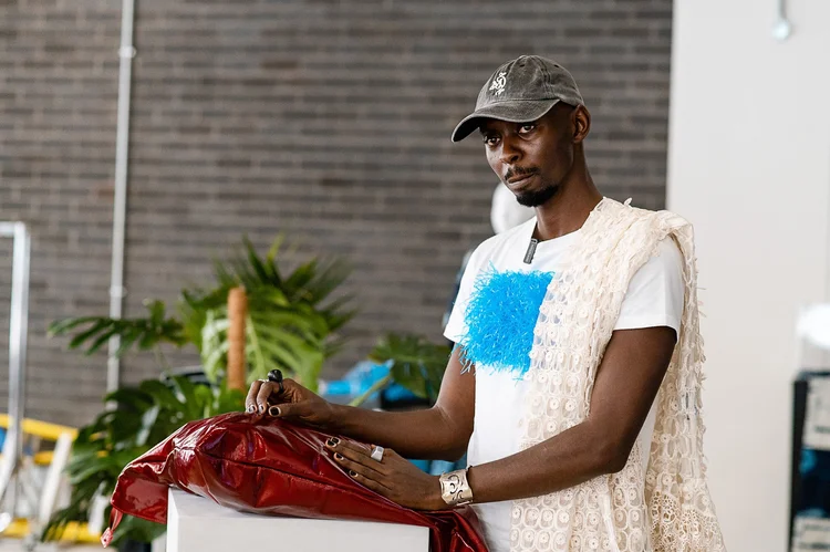 AFWL2025 Cohort Sevaria discussing his brand at the AFWL Designer Surgeries. Photo Credit: Africa Fashion Week London